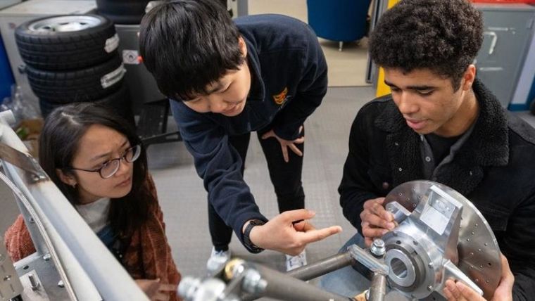 Formula 1 Scholar Sean (right) works alongside his classmates on the MEng in Engineering Science