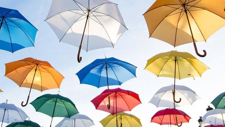 Multicoloured umbrellas suspended in the air