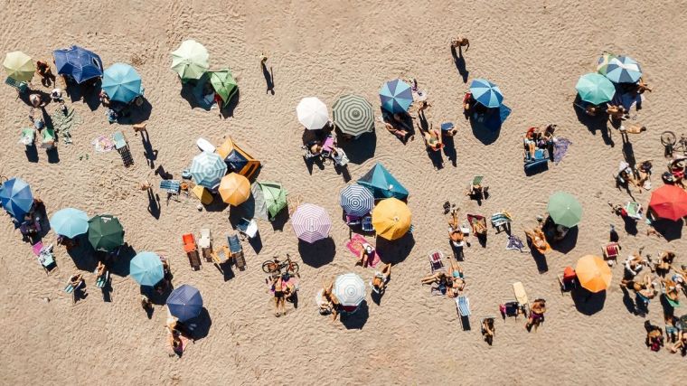 An aerial view of people on the beach