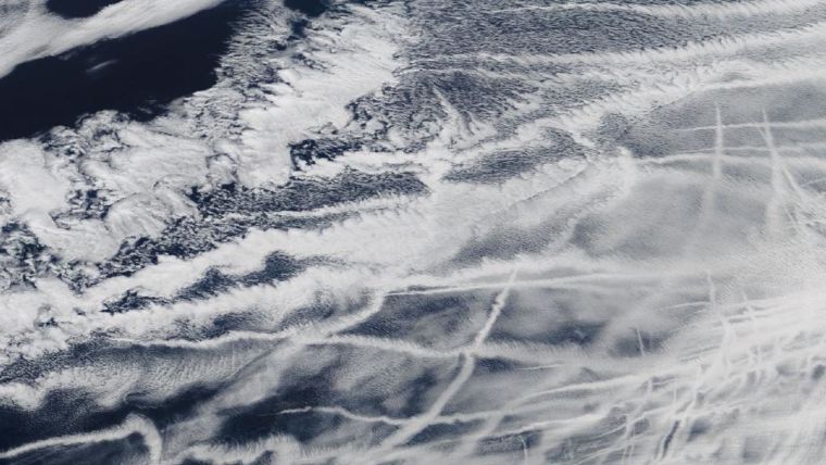 A satellite image with visible shipping emissions seen as tracks
