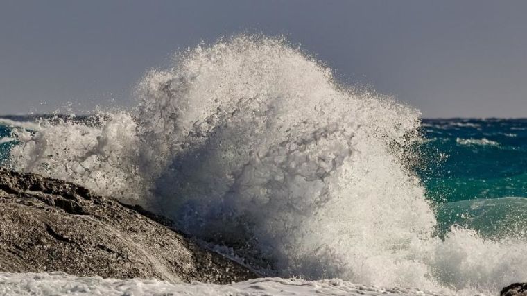 A wave breaking on a rock