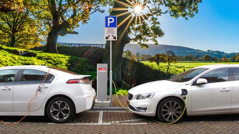 Two electric cars at a charging point
