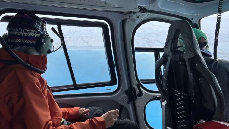Associate Professor Laura Stevens (right) and co-author Professor Meredith Nettles (left, Columbia University) approach a Greenland supraglacial lake via helicopter 

Photo by Marianne Okal (UNAVCO, Inc.)