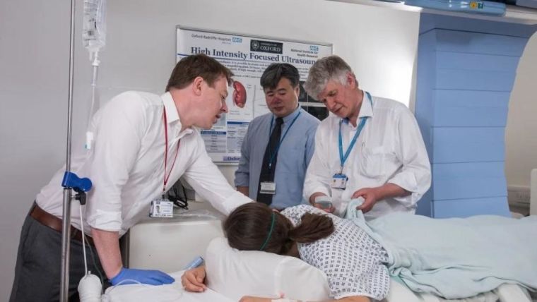 Dr Paul Lyon, Professor Feng Wu and Professor David Cranston with a patient in the HIFU unit in Oxford.