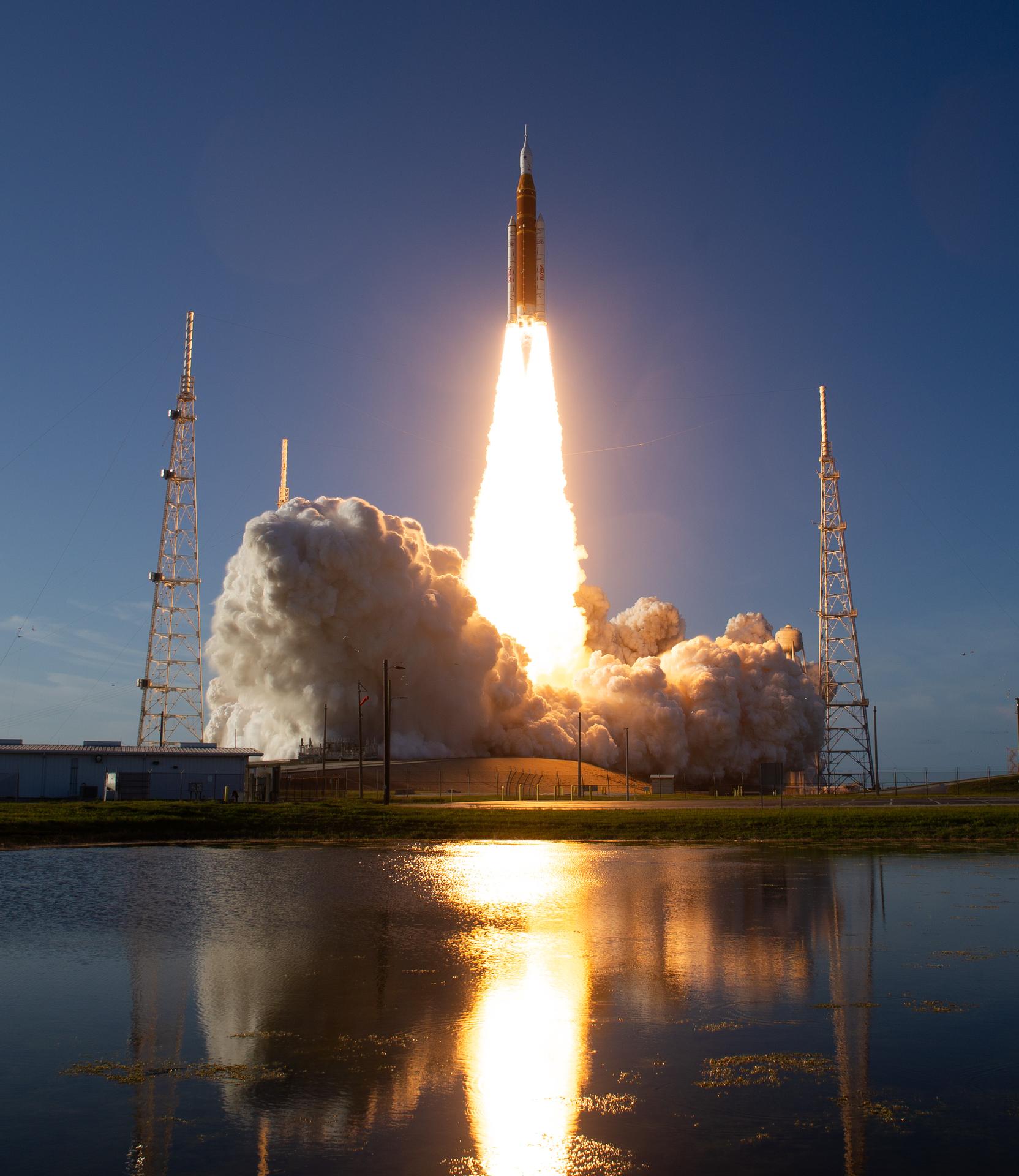 Artemis II rocket launch, illuminating the night sky