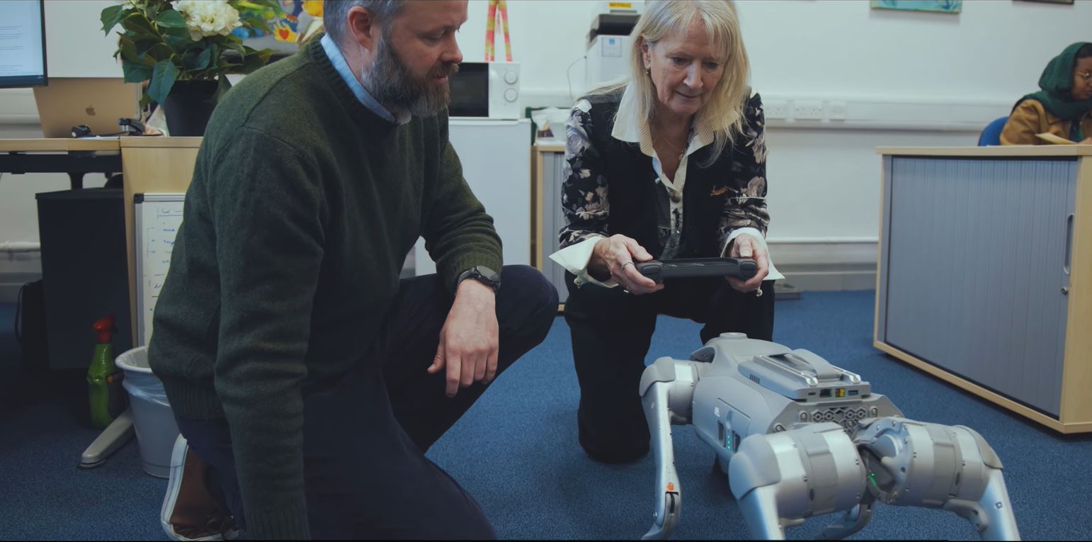Marina Jirotka with a robot dog